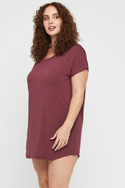 A model wearing the Bamboo Nightie in colour Burgundy (Red), from the front, cropped image