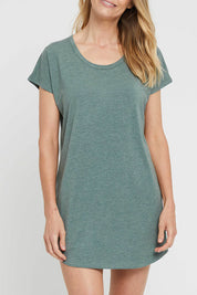 A model wearing the Bamboo Nightie in colour Moss (Green), from the front, cropped image