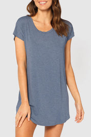 A model wearing the Bamboo Nightie in colour Twilight (Blue), from the front, cropped image