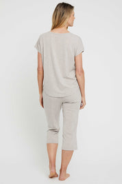 A model wearing the 3/4 Bamboo PJ Pant in colour Oatmeal, from the back