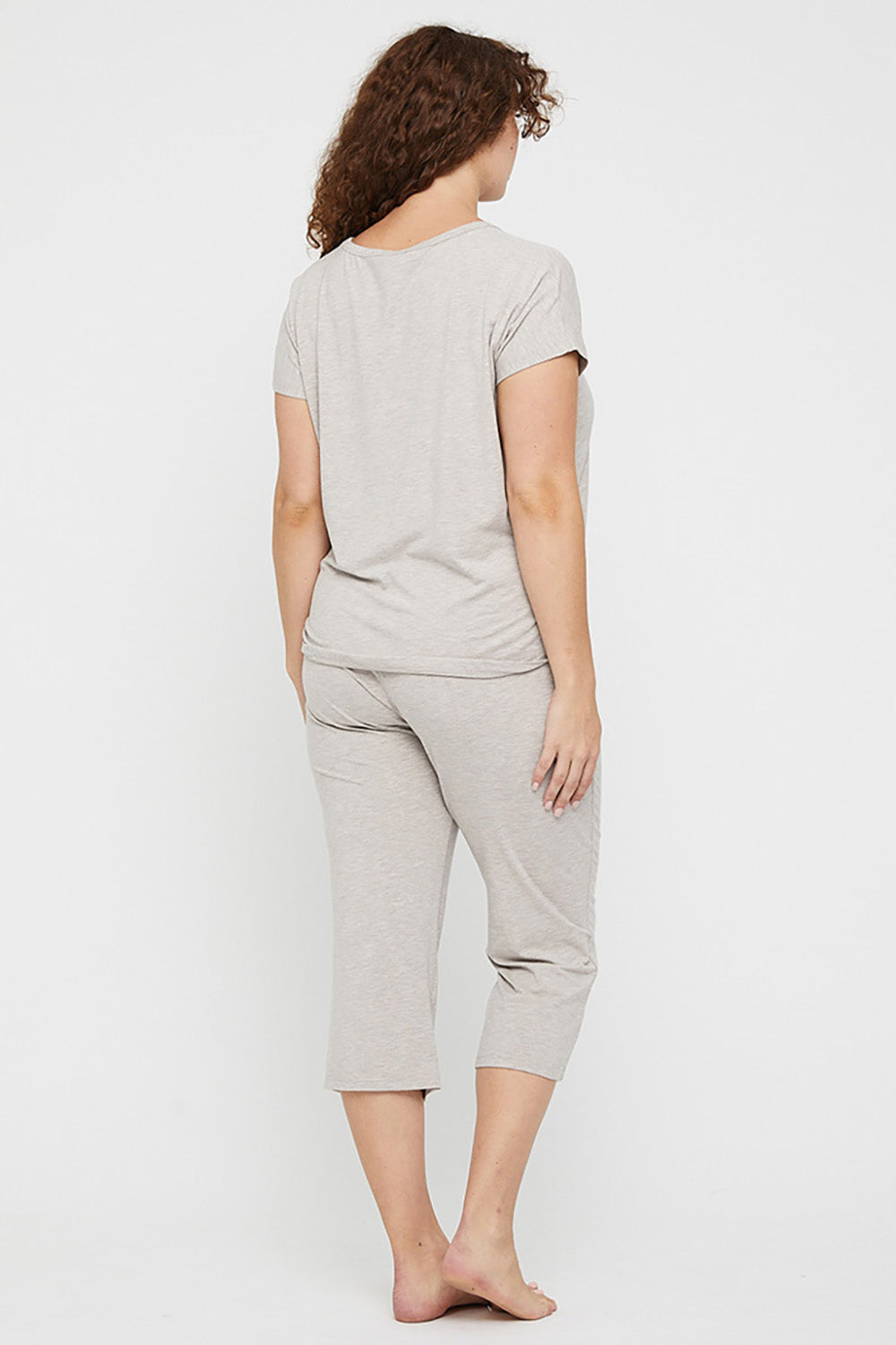 A model wearing the 3/4 Bamboo PJ Pant in colour Oatmeal, from the back