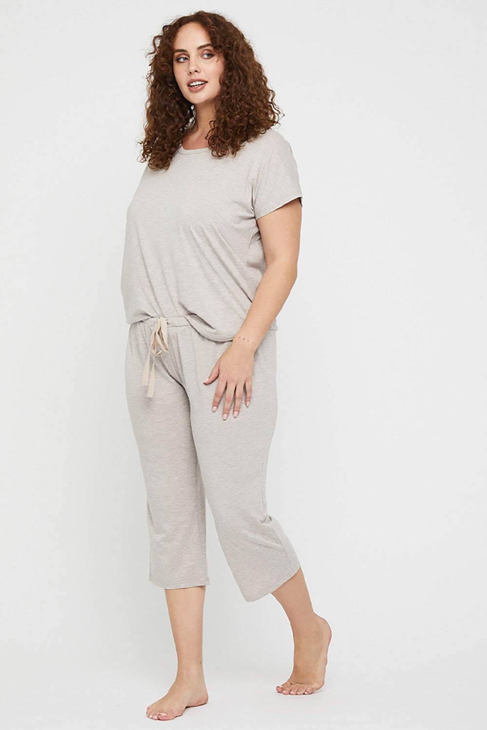 A model wearing the 3/4 Bamboo PJ Pant in colour Oatmeal, from the front, showing the whole outfit