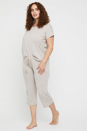A model wearing the 3/4 Bamboo PJ Pant in colour Oatmeal, from the front, showing the whole outfit