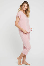 A model wearing the 3/4 Bamboo PJ Pant in colour Rose (Pink), from the front, showing the whole outfit