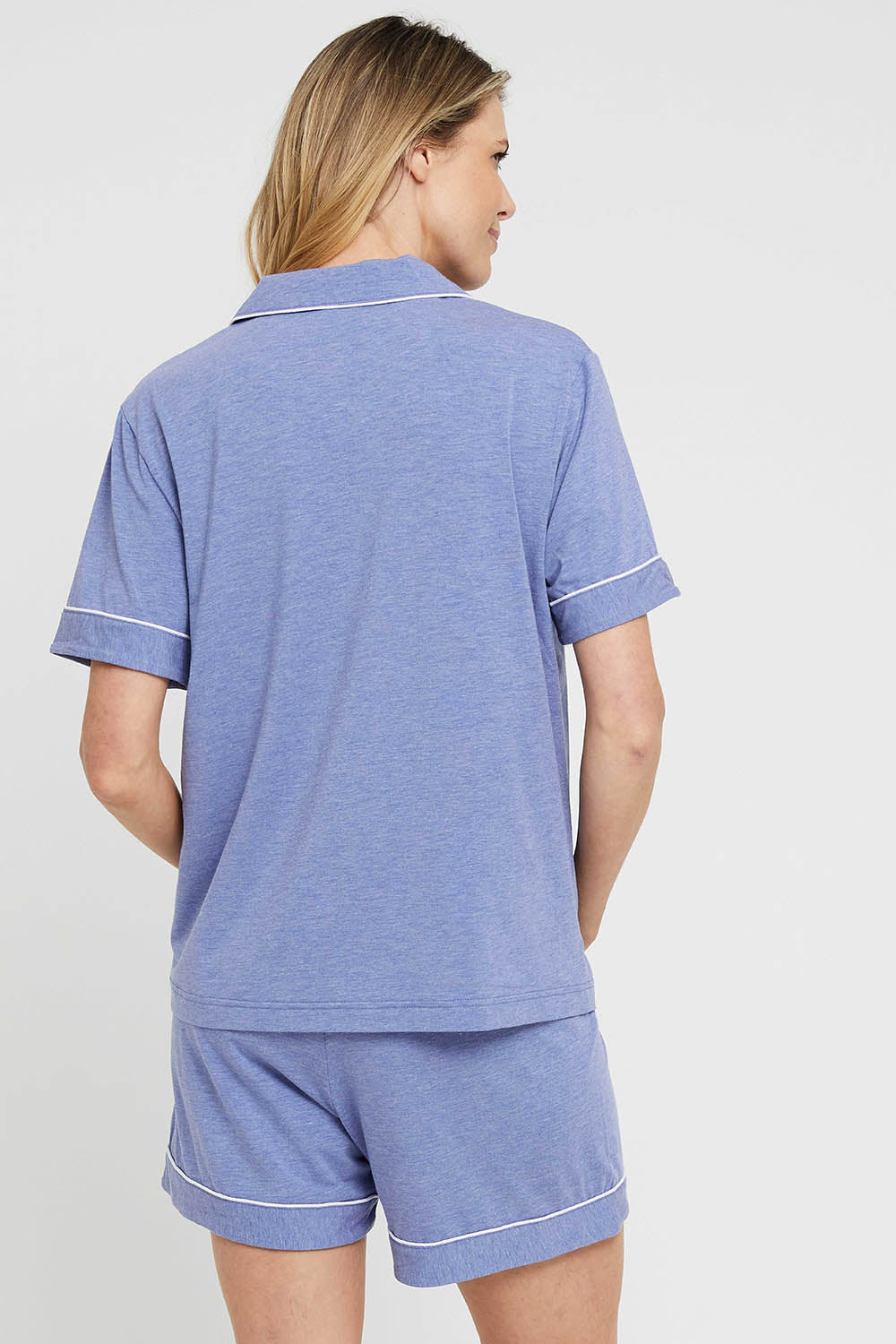 A model wearing the Bamboo PJ Set in colour Lavender (Blue), from the back