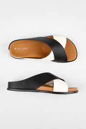 Model Genericm wearing size sample of the Mystic Leather Slide - Blackice in colour Blackice, from an angle