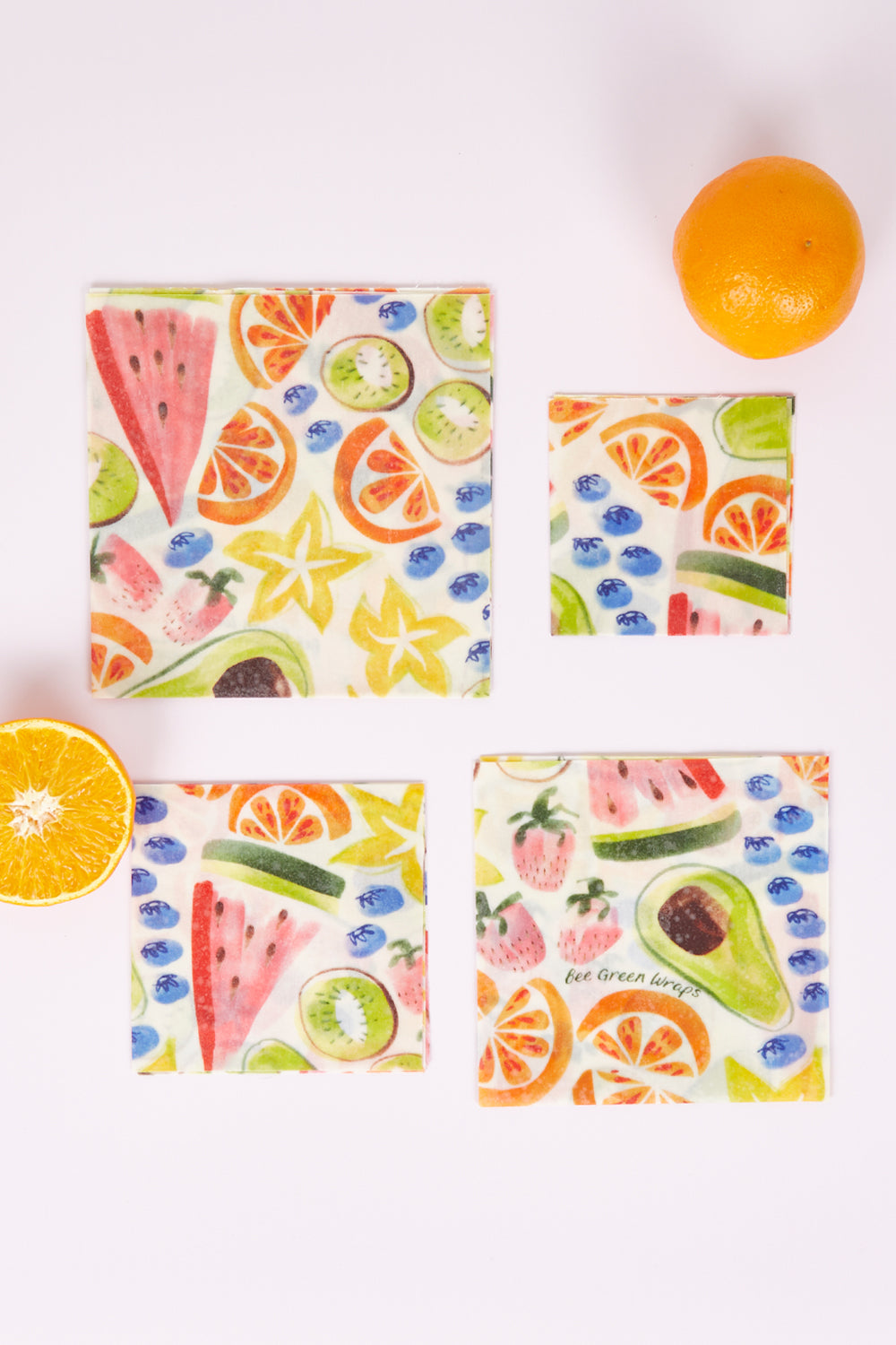 A model wearing size OneSize of the Organic Cotton Four Starter Beeswax Wraps Pack in colour Fruit (White), from the front, showing the whole outfit