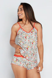 A model wearing the Liberty Bramble Short in colour Fiestabrum (Red), from the front, cropped image