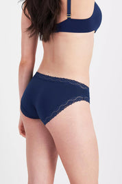 Model Genericm wearing size sample of the Marais Cotton Bikini - Darksapphire in colour Darksapphire, from an angle