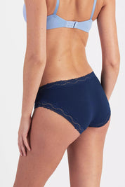 Model Genericm wearing size sample of the Marais Cotton Bikini - Darksapphire in colour Darksapphire, from an angle