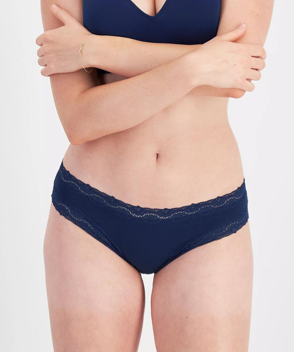 Model Genericm wearing size sample of the Marais Cotton Bikini - Darksapphire in colour Darksapphire, in a cropped view