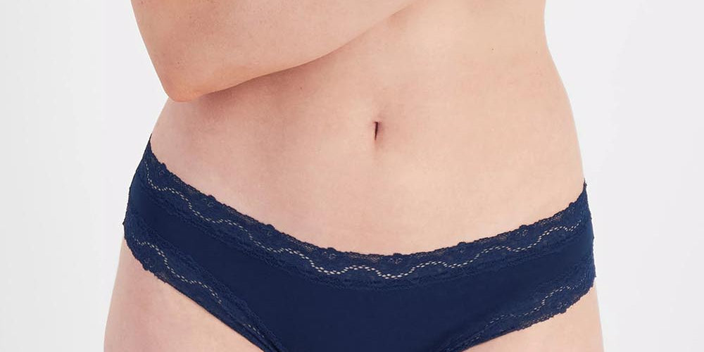 Model Genericm wearing size sample of the Marais Cotton Bikini - Darksapphire in colour Darksapphire, in a cropped view