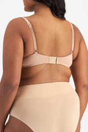 A model wearing the Bbb Contour Comfort Bra in colour Nude (White), from the back