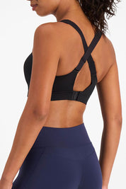 A model wearing the Smooth Power Wirefree Sports Bra in colour Black (Black), from the back
