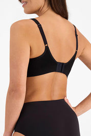 A model wearing the Postin colourSurgery Recovery Bra - Black (Black), from the back