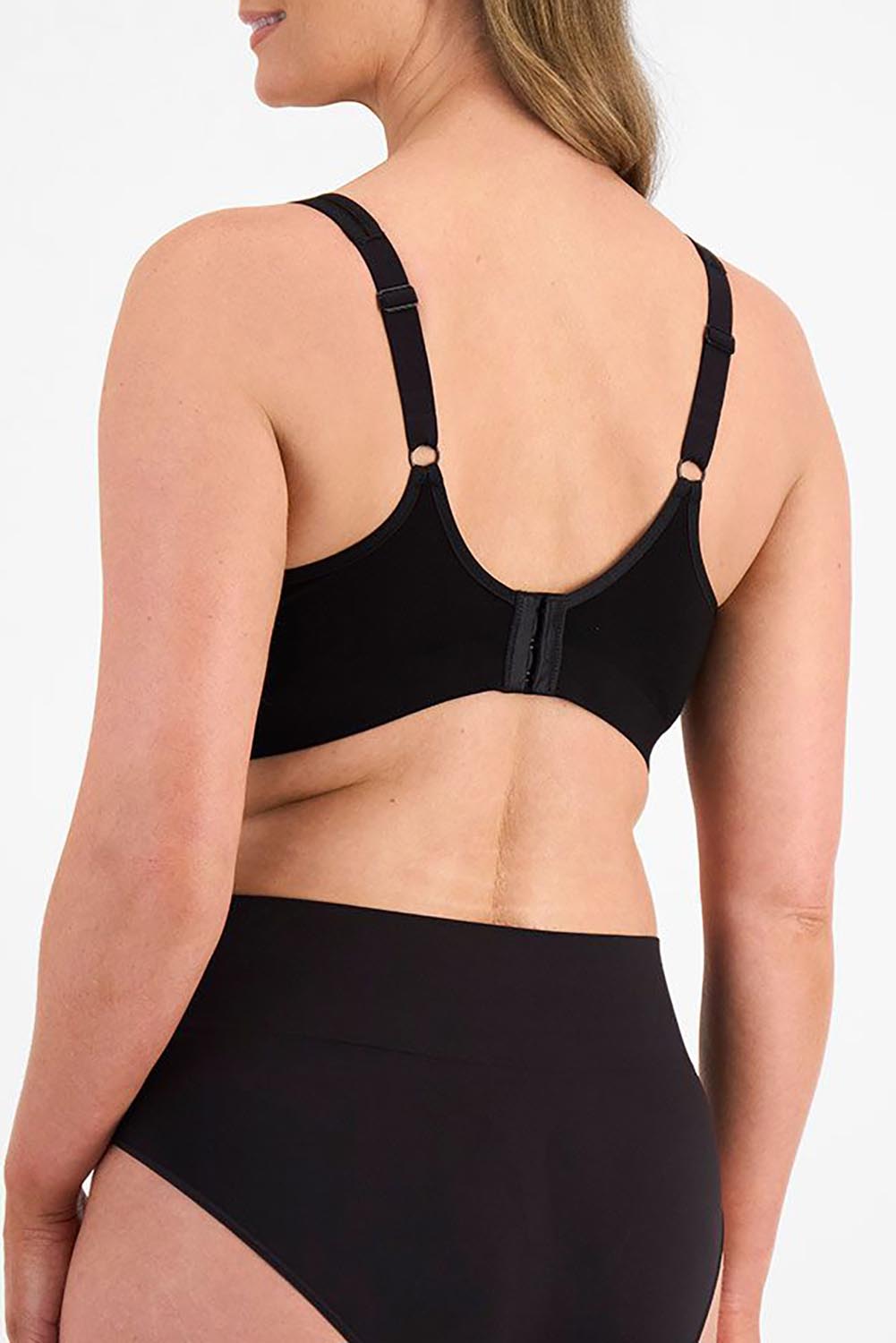 A model wearing the Postin colourSurgery Recovery Bra - Black (Black), from the back
