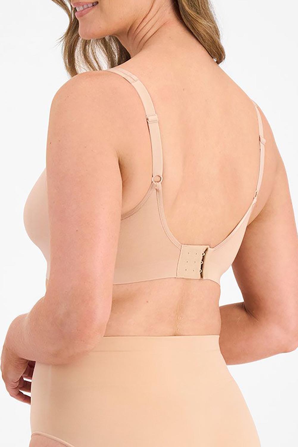 A model wearing the Postin colourSurgery Recovery Bra - Nude, from the back