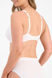 A model wearing the Barely There Lace Contour Bra in colour White (White), from the back