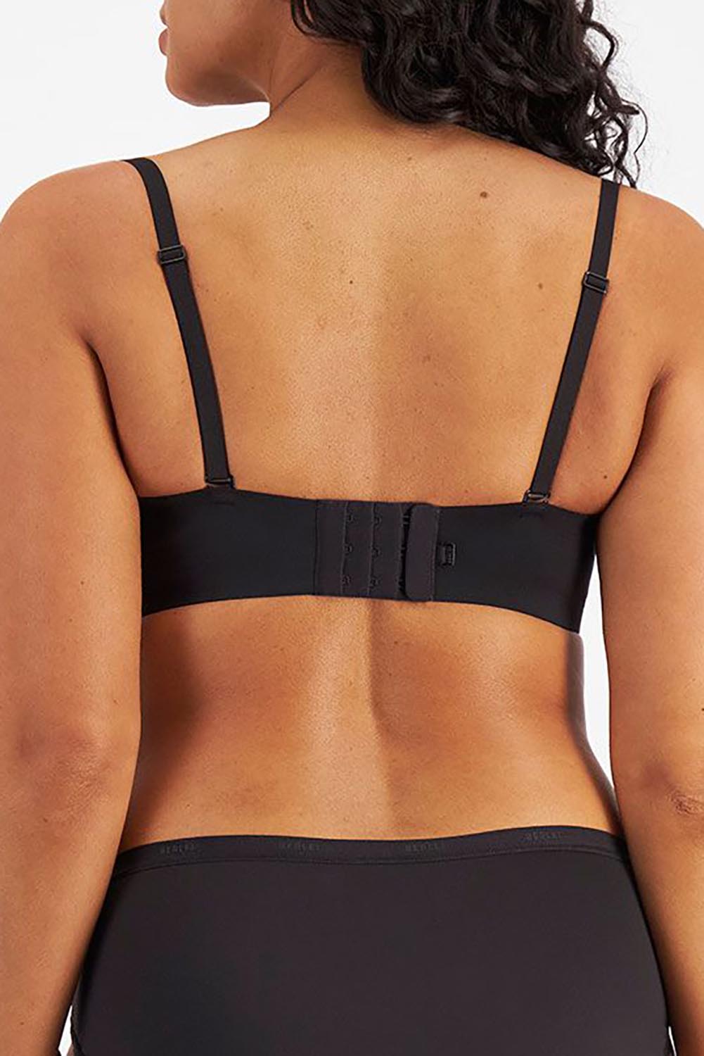 A model wearing the Luminous Strapless Bra in colour Black (Black), from the back