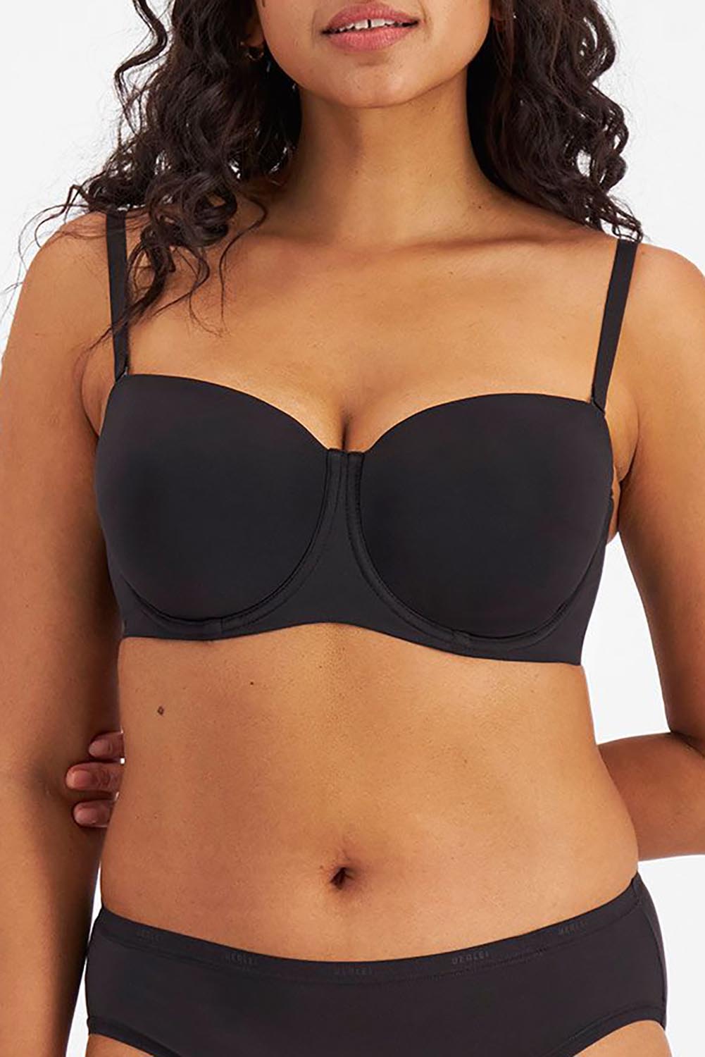 A model wearing the Luminous Strapless Bra in colour Black (Black), from the front, cropped image