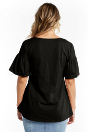 A model wearing the Alessi Frill Top in colour Black (Black), from the back