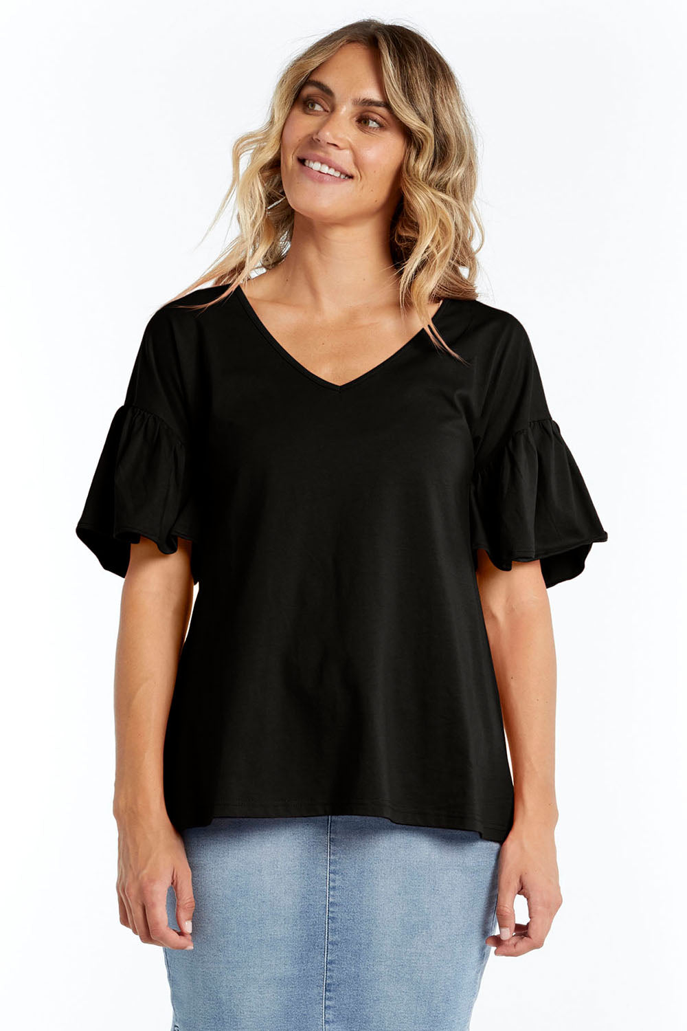 A model wearing the Alessi Frill Top in colour Black (Black), from the front, cropped image