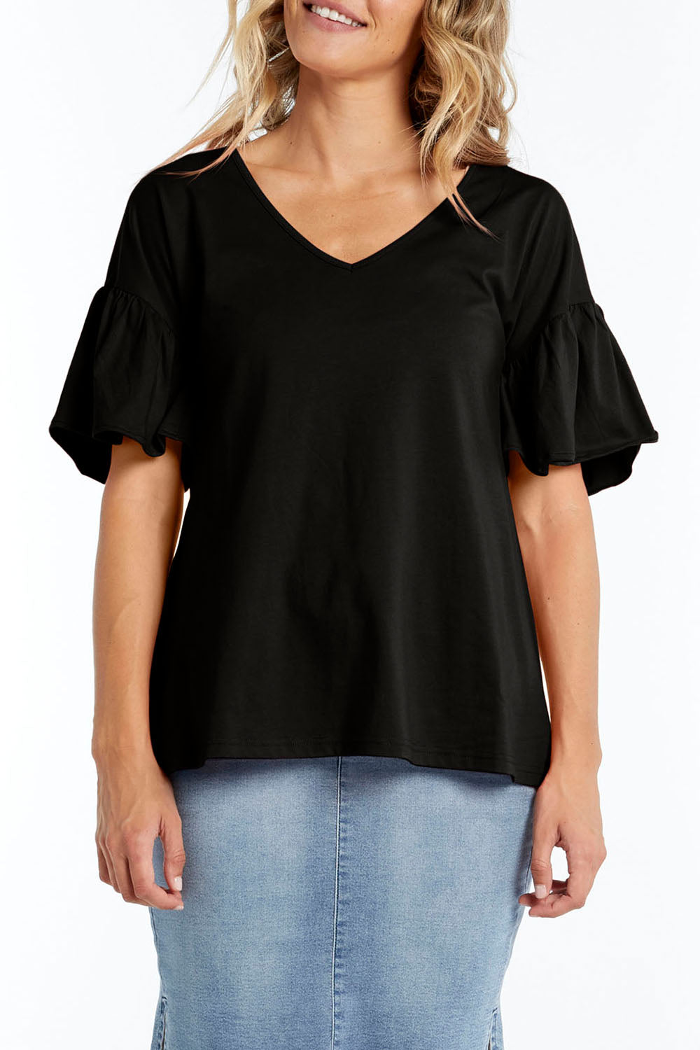 A model wearing the Alessi Frill Top in colour Black (Black), from the front, cropped image