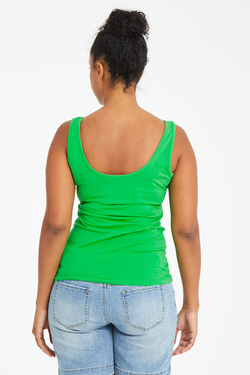Model Noli wearing size 14 of the Emma Tank in colour Kiwi (Green), from the back