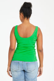 Model Noli wearing size 14 of the Emma Tank in colour Kiwi (Green), from the back