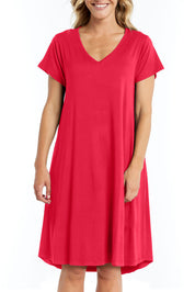 A model wearing the Brooke Dress in colour Rosered (Red), from the front, cropped image