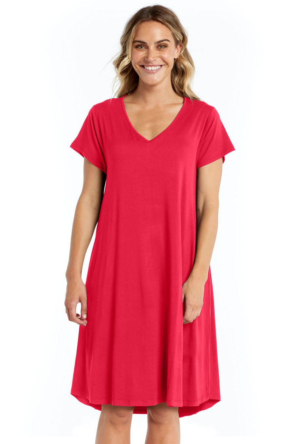 A model wearing the Brooke Dress in colour Rosered (Red), from the front, cropped image