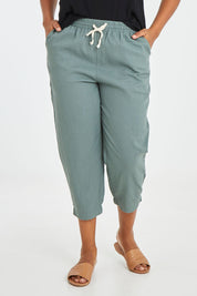 Model Noli wearing size 14 of the Lennon Pant in colour Deepgrn (Green), from the front, cropped image