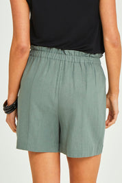 Model Elhana wearing size 8 of the Baker Short in colour Deepgrn (Green), from the back