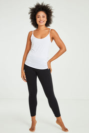 Model Olivia wearing size 10 of the Veronica Reversible Cami in colour White (White), from the front, showing the whole outfit