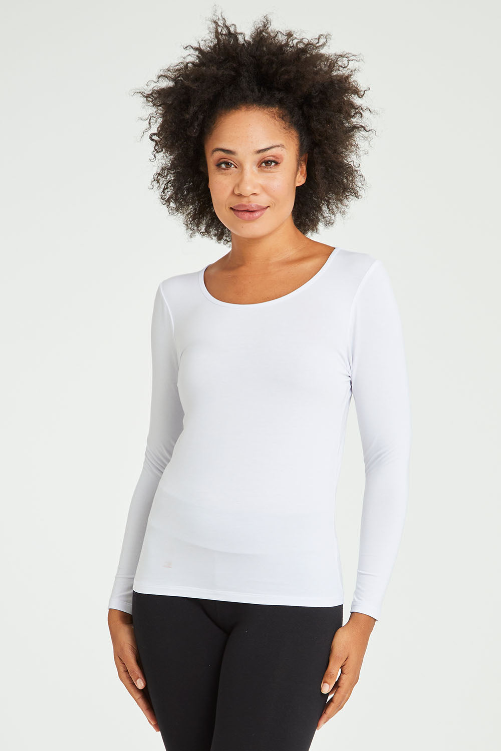 Model Olivia wearing size 10 of the Kelli Long Sleeve Top in colour White (White), from the front, cropped image