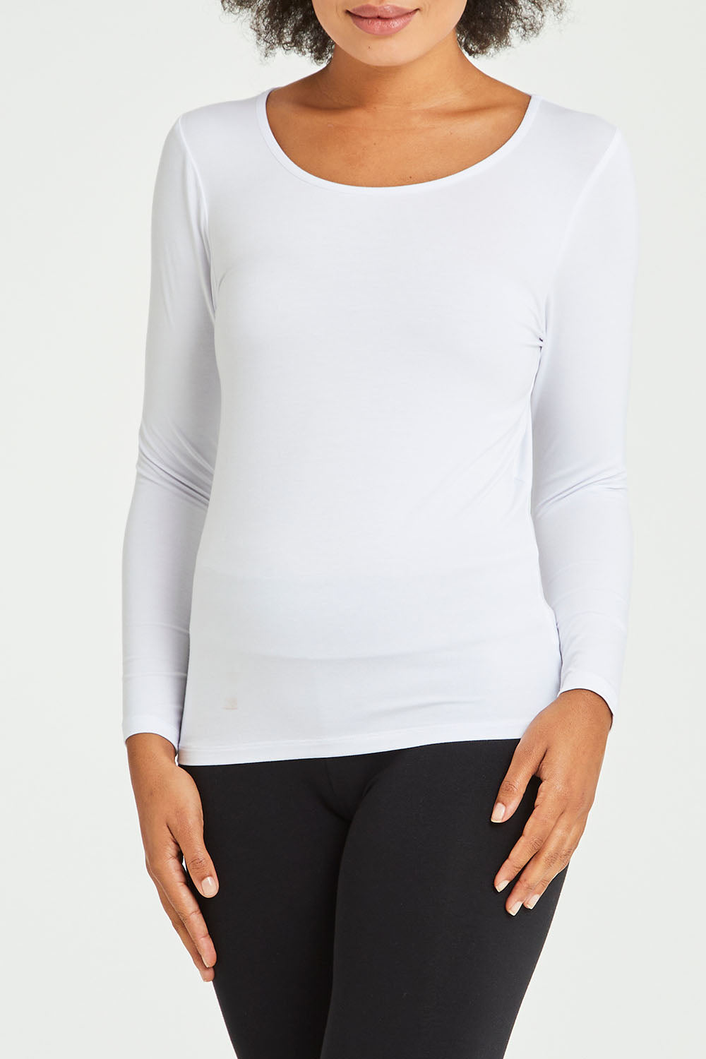 Model Olivia wearing size 10 of the Kelli Long Sleeve Top in colour White (White), from the front, cropped image