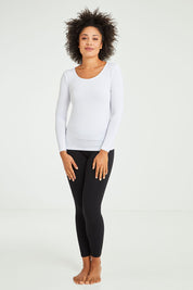 Model Olivia wearing size 10 of the Kelli Long Sleeve Top in colour White (White), from the front, showing the whole outfit