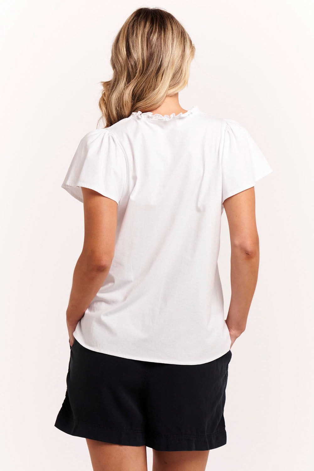 A model wearing the Bree Tin colourShirt - White (White), from the back