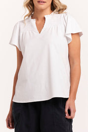 A model wearing the Bree Tin colourShirt - White (White), from the front, cropped image