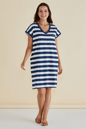 A model wearing the Zena Cotton Tin colourShirt Dress - Navystripe (Blue), from the front, showing the whole outfit
