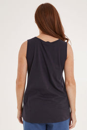 Model Sally wearing size 10 of the Josie Tank in colour Coal (Black), from the back