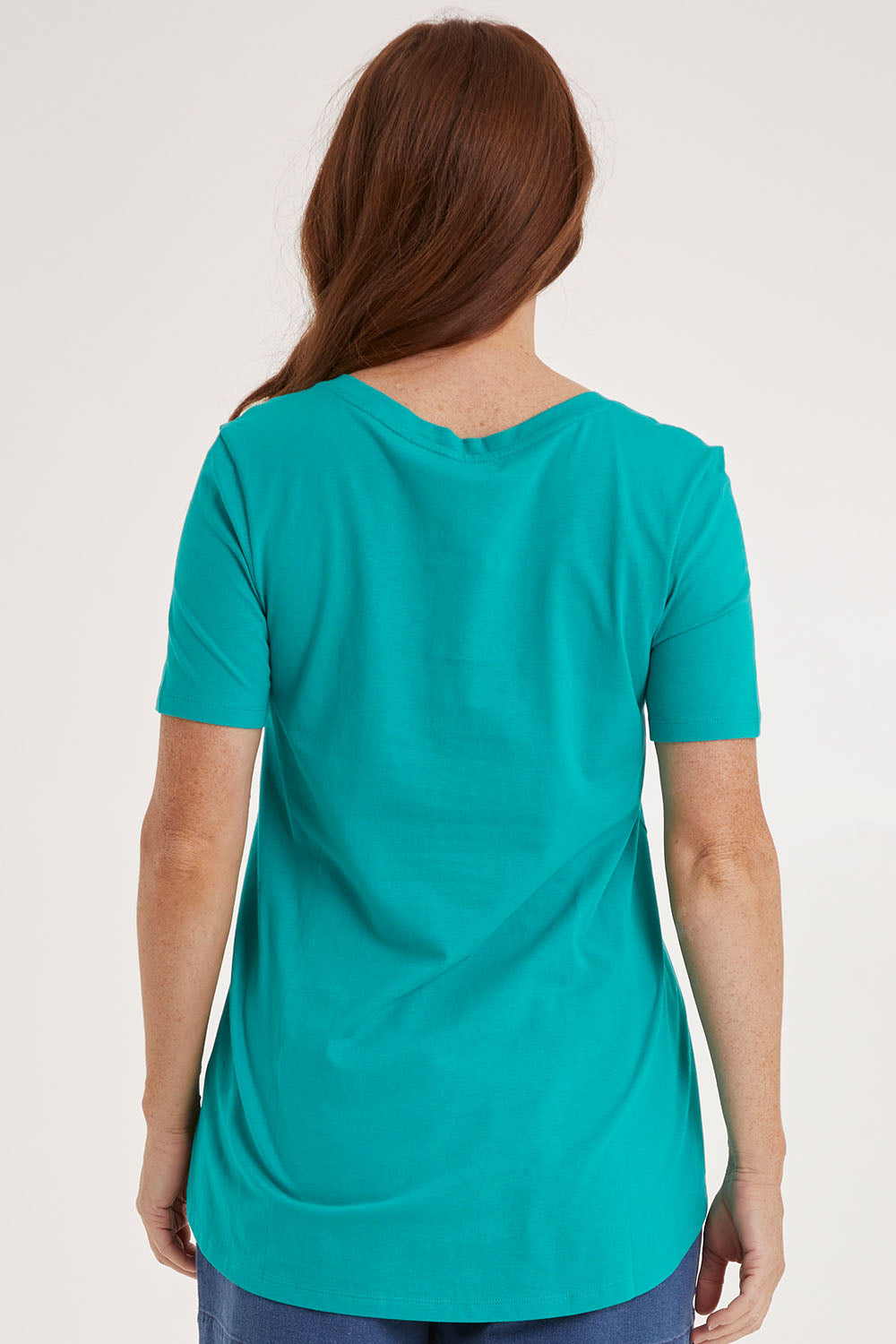 Model Sally wearing size 10 of the Luella Tee in colour Teal (Green), from the back