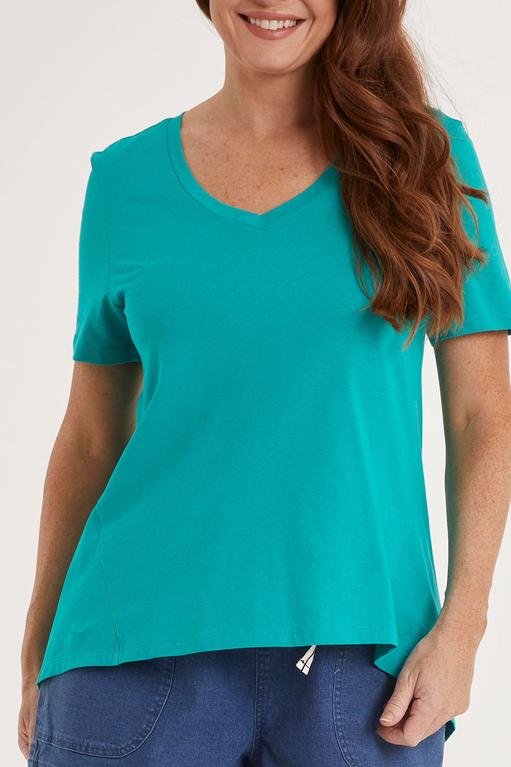 Model Sally wearing size 10 of the Luella Tee in colour Teal (Green), from the front, cropped image