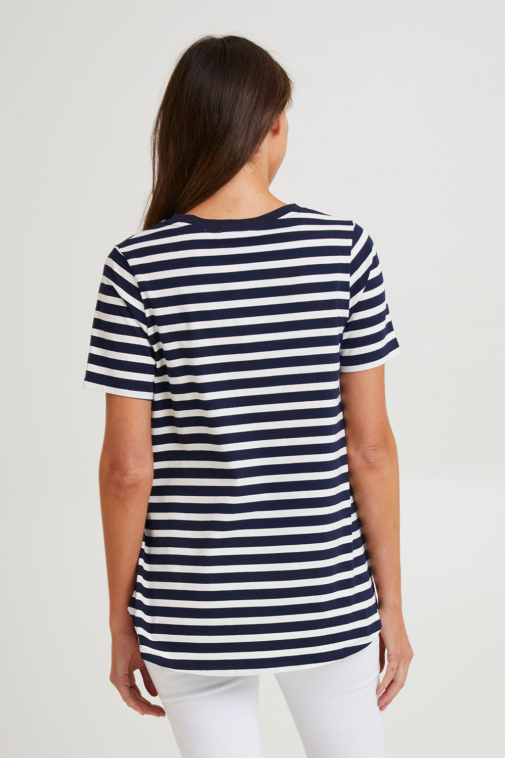 Model Madeline wearing size 10 of the Luella Australian Cotton Tee in colour Navystripe (Blue), from the back