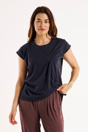 A model wearing the Michaela Australian Cotton Top in colour Coal (Black), from the front, cropped image