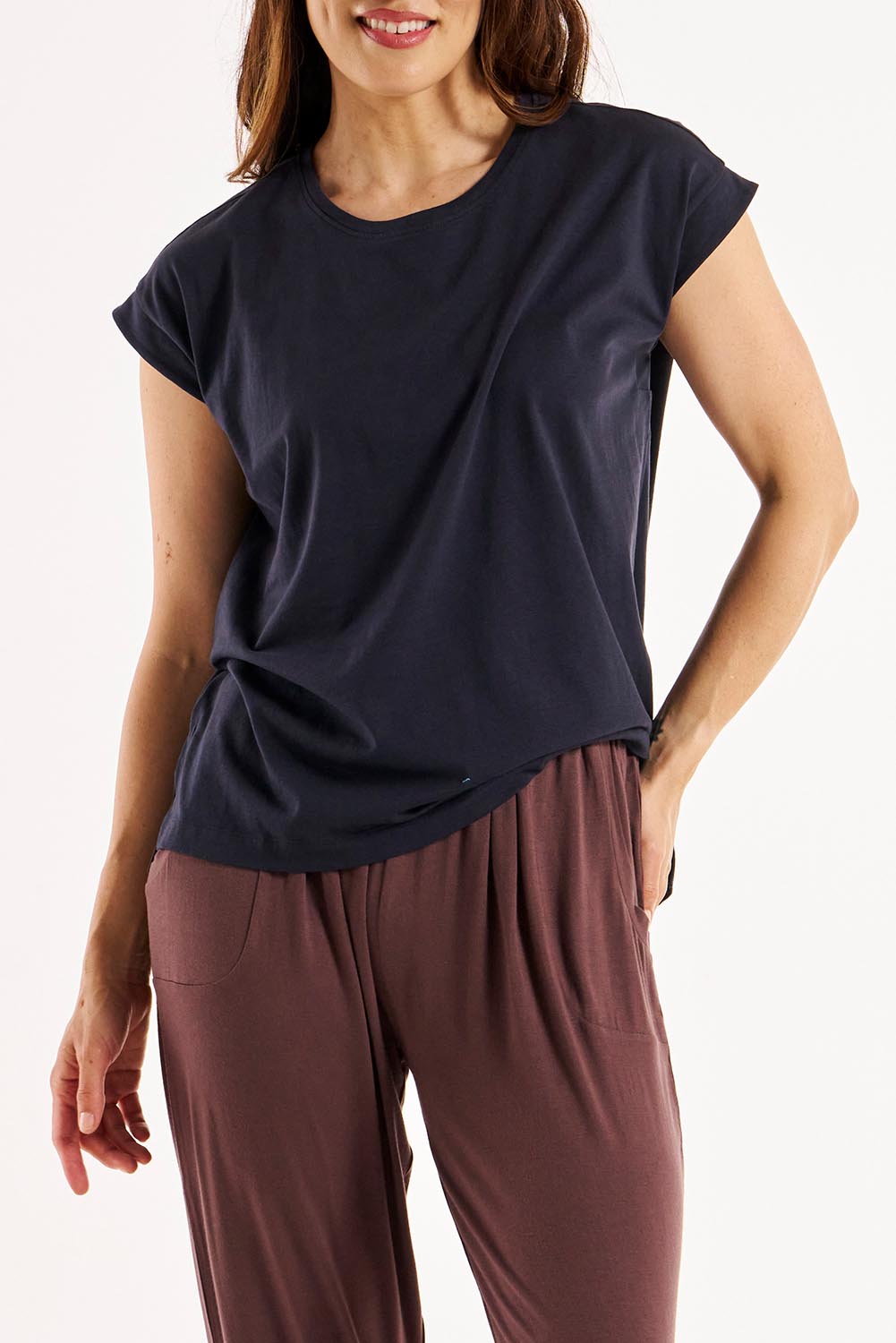 A model wearing the Michaela Australian Cotton Top in colour Coal (Black), from the front, cropped image