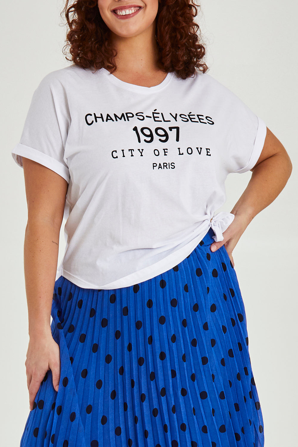 Model Maddy wearing size 16 of the Avril Print Tee in colour White (White), from the front, cropped image