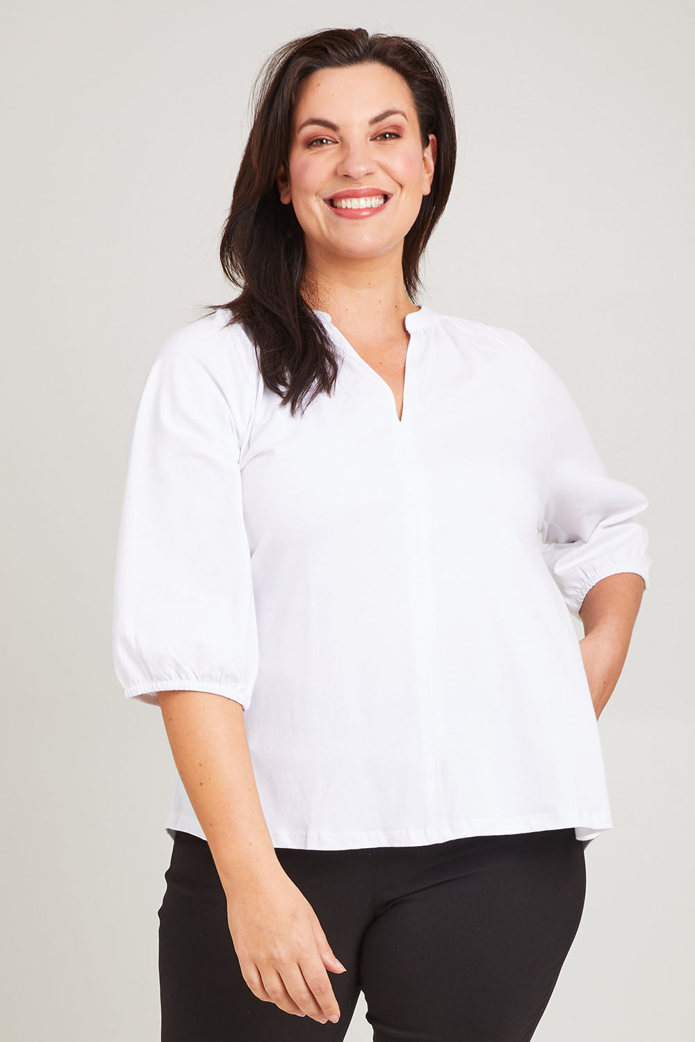 Model Poppy wearing size 16 of the Prue Tee in colour White (White), from the front, cropped image