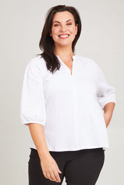 Model Poppy wearing size 16 of the Prue Tee in colour White (White), from the front, cropped image