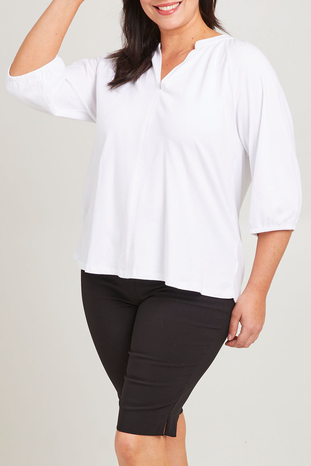 Model Poppy wearing size 16 of the Prue Tee in colour White (White), from the front, cropped image